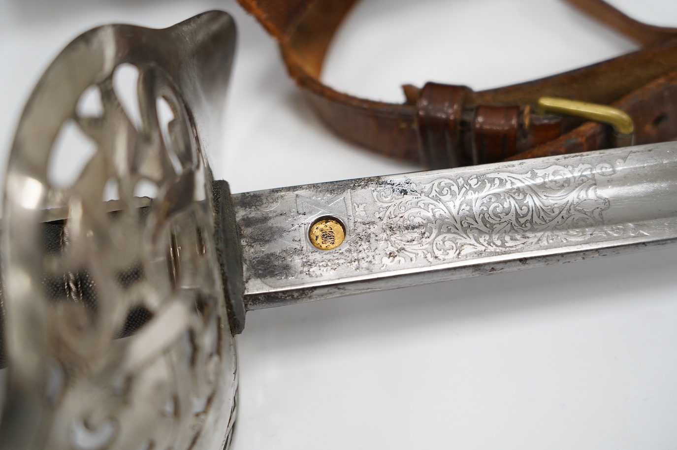 An 1895 pattern infantry officer’s sword by Wilkinson, proof number 34431, blade 82cm, in it’s leather field service scabbard with hangers and sword knot, with supporting research confirming that it was purchased by the